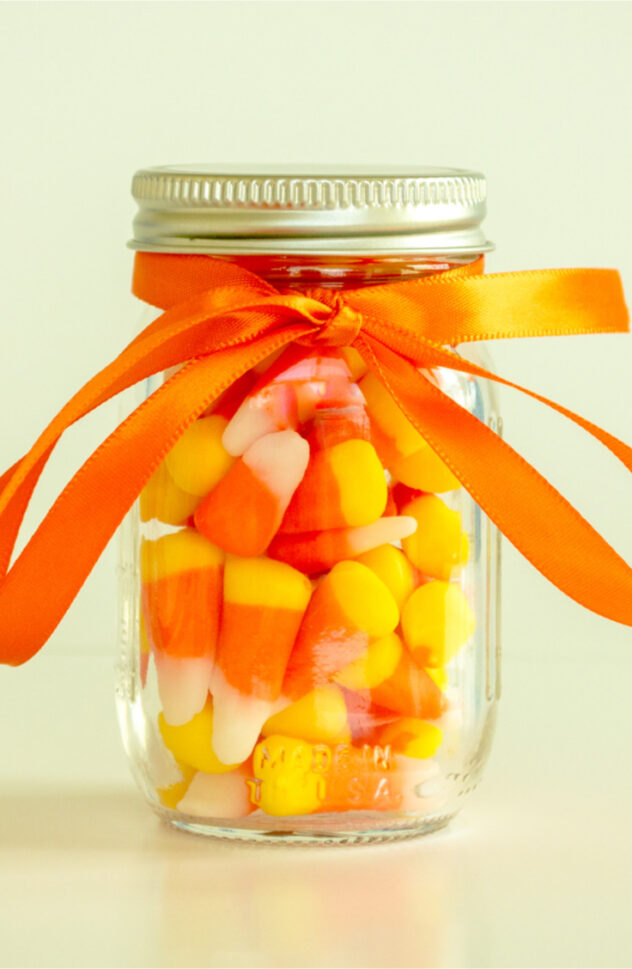 Candy corn mason jars are the perfect gift for your friends this fall! Here are 20 spellbinding fall mason jar crafts DIY ideas!