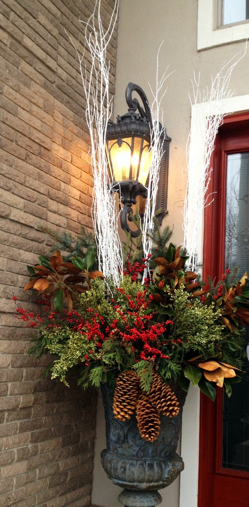 As you decorate your home this season, don't forget to include winter porch outdoor Christmas planters. Lights are amazing, but any of these outdoor Christmas planters will put the finishing touch on your winter porch decor. Don't miss them!