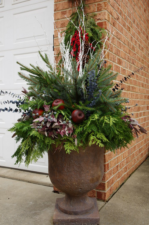 As you decorate your home this season, don't forget to include winter porch outdoor Christmas planters. Lights are amazing, but any of these outdoor Christmas planters will put the finishing touch on your winter porch decor. Don't miss them!