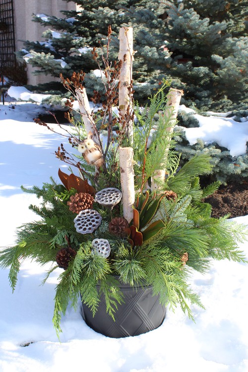 As you decorate your home this season, don't forget to include winter porch outdoor Christmas planters. Lights are amazing, but any of these outdoor Christmas planters will put the finishing touch on your winter porch decor. Don't miss them!