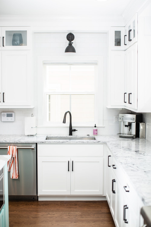 farmhouse white kitchen with stainless steel appliances