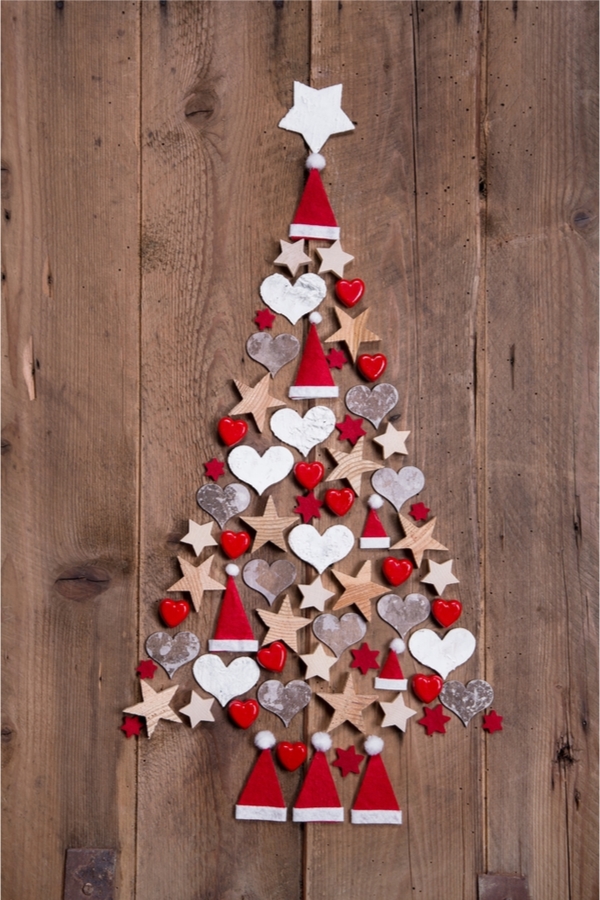Looking for fun Rustic Christmas Decorations to make? All you need are some shapes, glue, and wood to make this adorable Christmas tree.